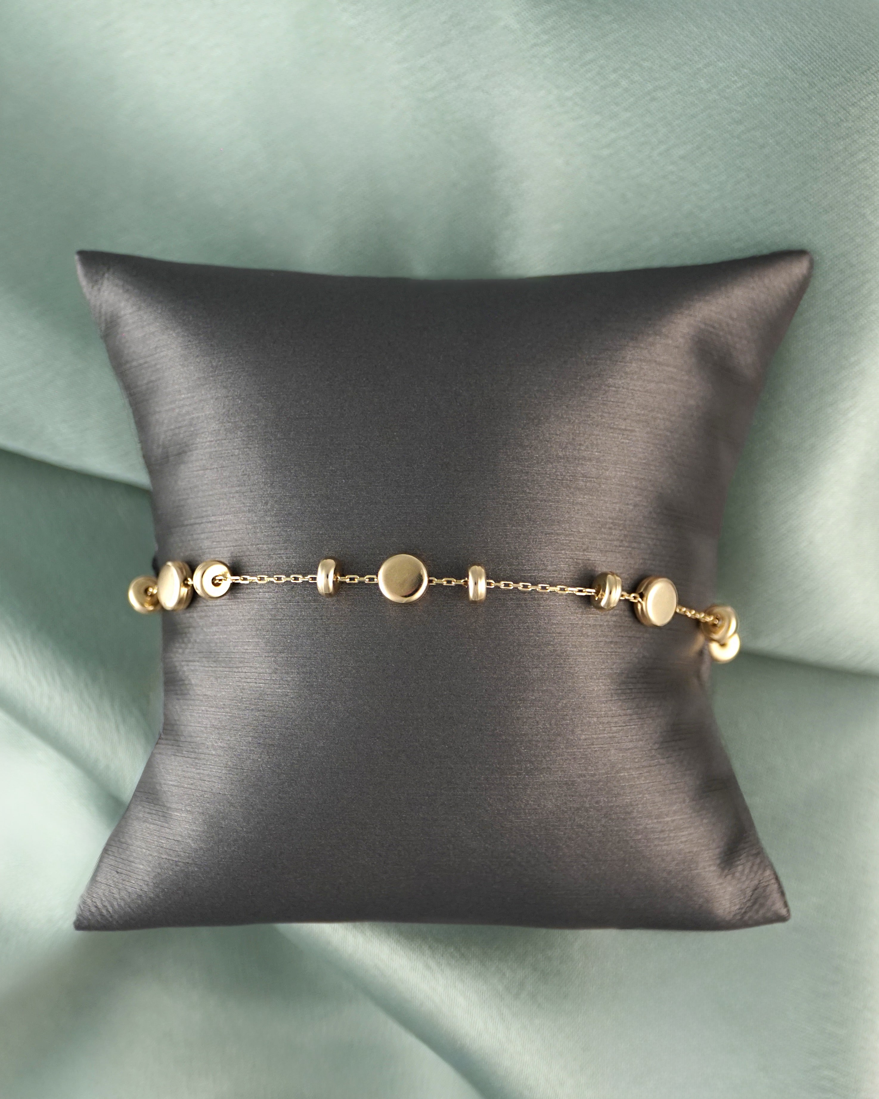 14kt Gold Bracelet with Multi Size Disc Stations