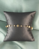 14kt Gold Bracelet with Multi Size Disc Stations